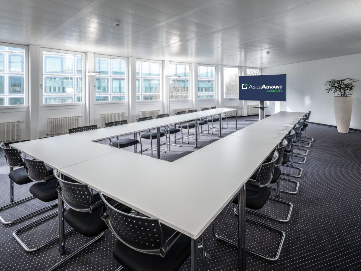 AgileAdvant Academy training room in Lucerne with presentation screen and classroom setup
