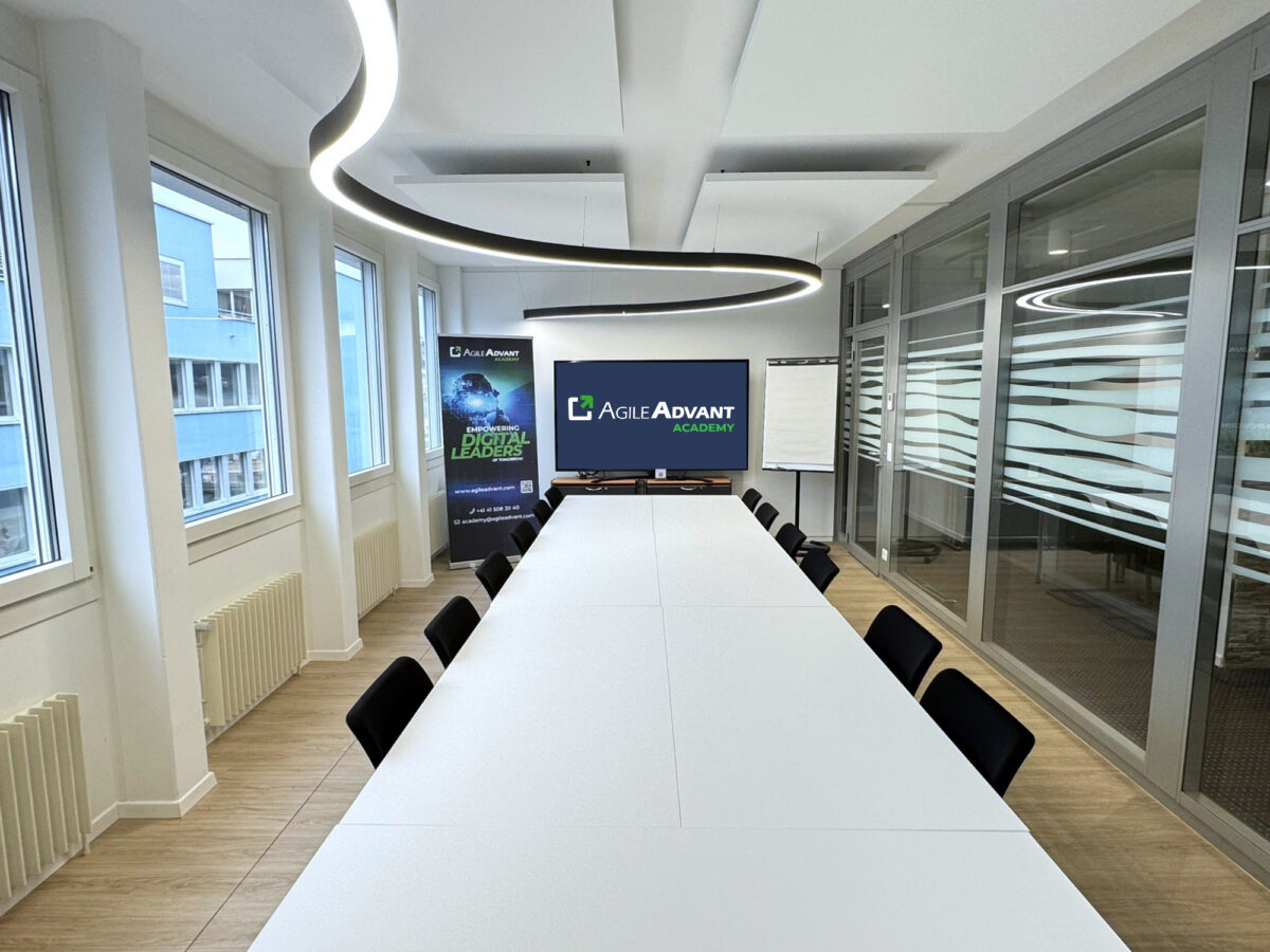 Modern AgileAdvant Academy training room with long table and presentation setup
